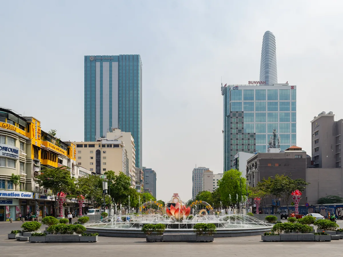 Nguyen Hue Street in central Ho Chi Minh City with a fountain and high-rise buildings